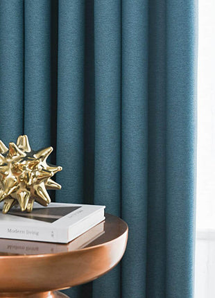 a table with a book and a gold star decoration on top of it