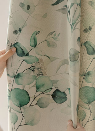 a person is opening the curtains with their hand