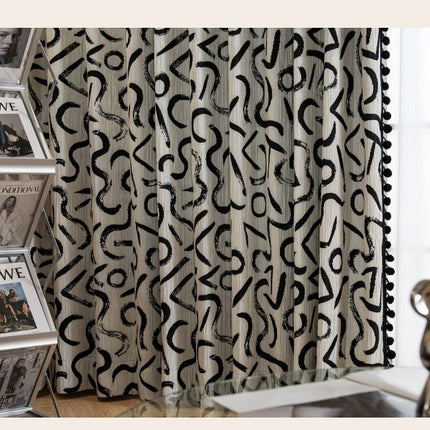 a curtain with a black and white pattern on it