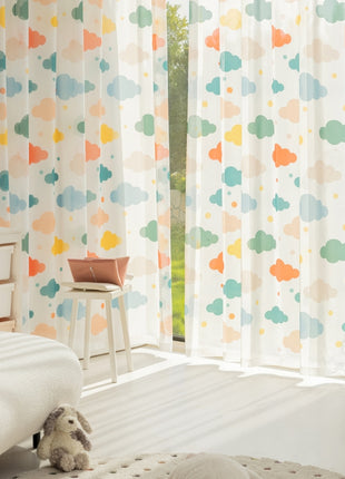 a child's bedroom with a teddy bear sitting on the bed