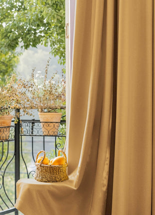 a basket of oranges sitting on top of a window sill