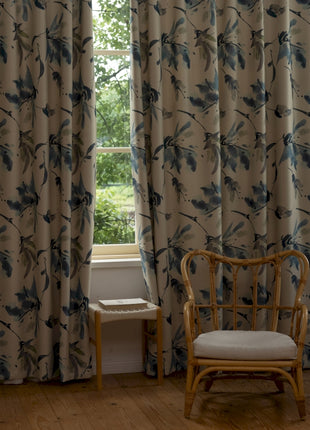 a chair sitting in front of a window next to a window