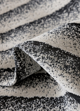 a close up of a black and white blanket