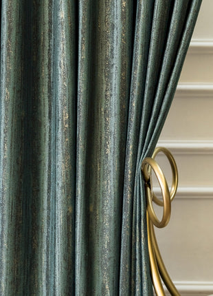 a close up of a curtain with a gold handle