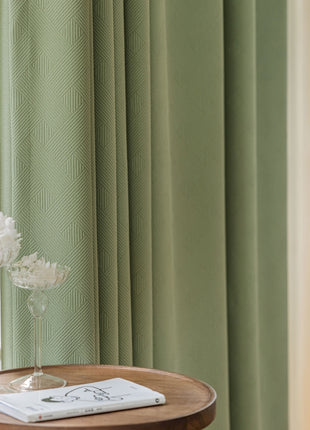a table with a vase of flowers on top of it
