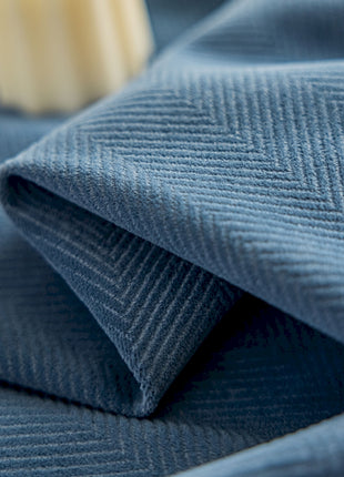 a close up of a blue cloth with a toothbrush