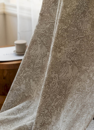 a close up of a chair with a blanket on it