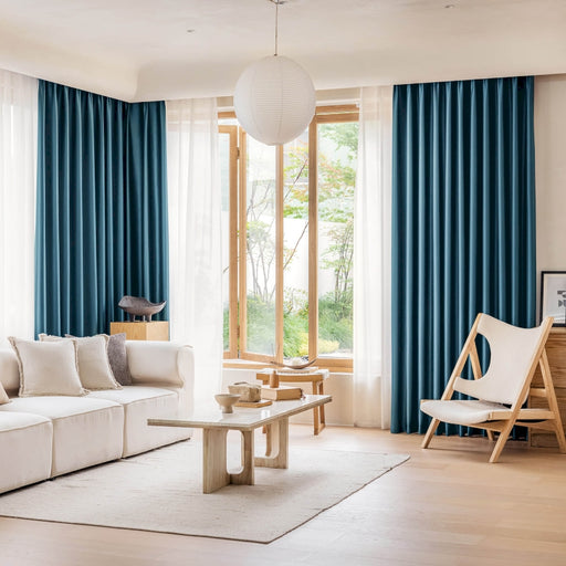 a living room filled with furniture and a large window