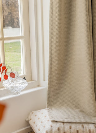 a vase of flowers sitting on a window sill