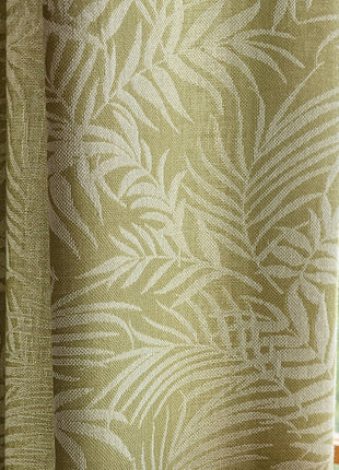 a close up of a window with a curtain