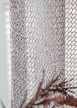 a close up of a curtain with a lizard on it