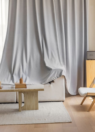 a living room with a white couch and a coffee table