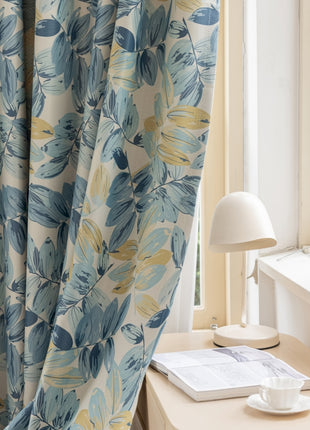 a desk with a lamp and a book on it