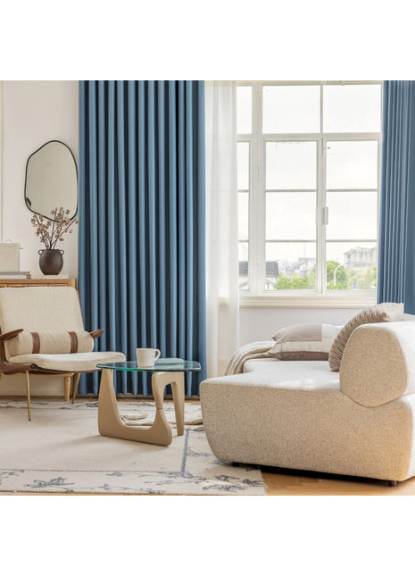 a living room filled with furniture and a large window