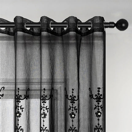 a black and white photo of a curtain