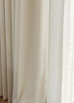 a close up of a window with white curtains