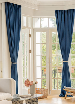 a living room filled with furniture and a large window