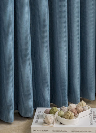 a bowl of balls sitting on top of a book