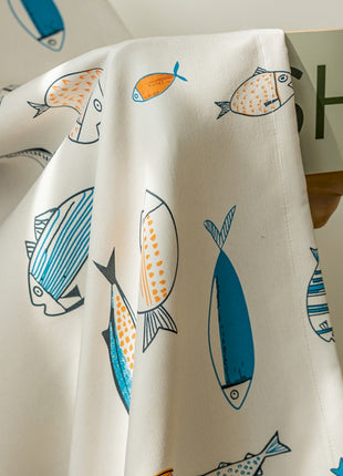 a close up of a curtain with fish on it