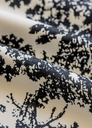 a close up of a black and white fabric