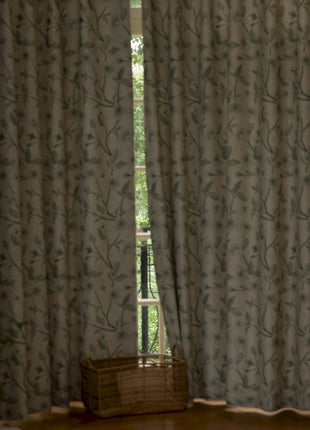 a living room with a large window and a chair