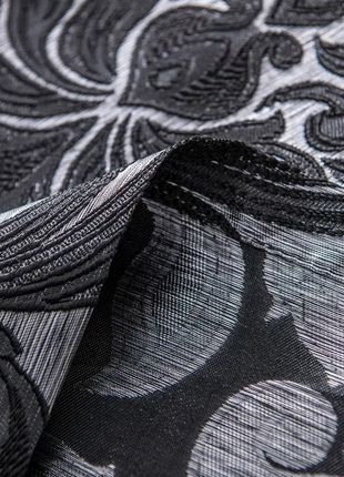 a close up of a black and white wallpaper