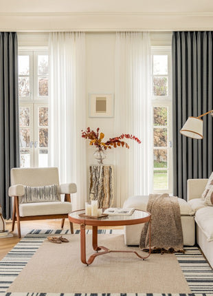a living room filled with furniture and a large window