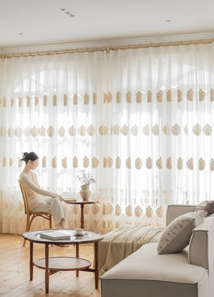 a woman sitting in a chair in front of a window