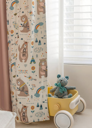 a teddy bear sitting in a wagon next to a window