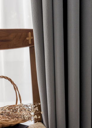 a wooden chair sitting next to a window