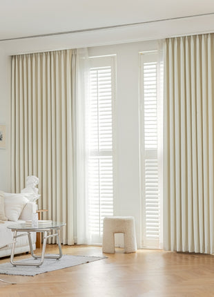 a living room with a white couch and a table