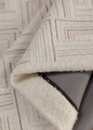 a close up of a rug on a wooden floor