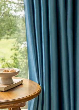 a bowl of food sitting on top of a wooden table
