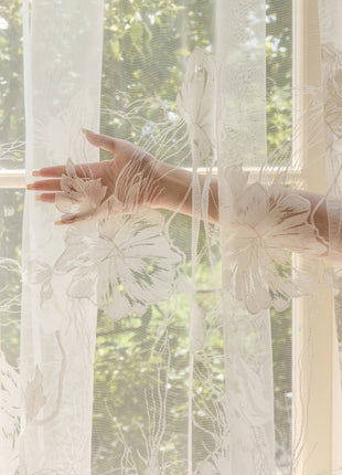 a woman's hand reaching out of a window