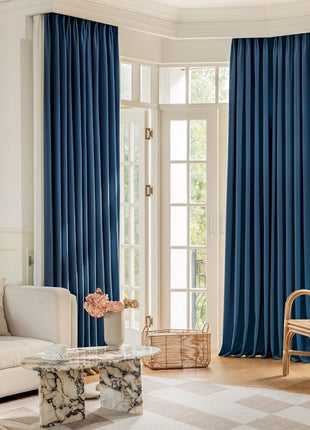 a living room filled with furniture and a large window