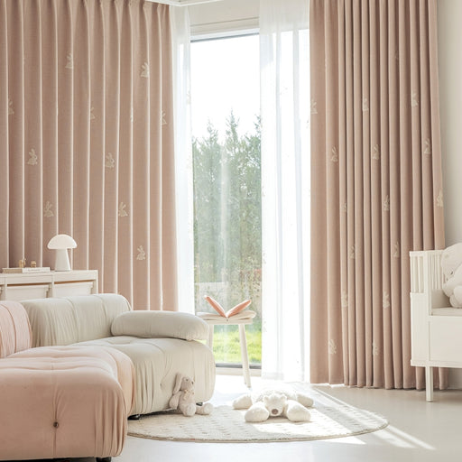 a living room filled with furniture and a large window