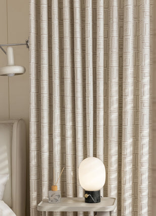 a bed room with a bed a night stand and a lamp