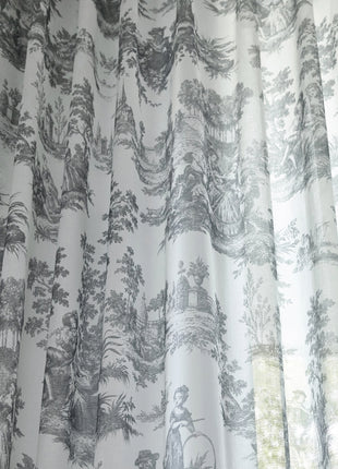 a curtain with a black and white toiler print