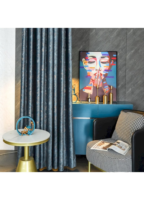 a living room with a chair and a painting on the wall