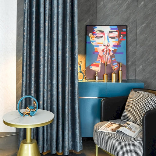 a living room with a chair and a painting on the wall
