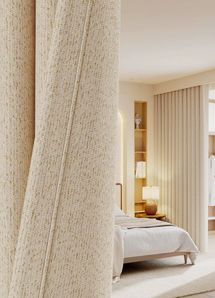 a serene and well-organized bedroom with a large bed, a nightstand, and a dresser. The room has a neutral color scheme with beige curtains and a white bedding set.