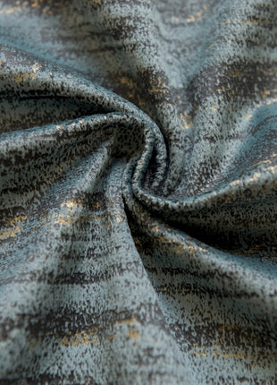 a close up of a blue and gold fabric