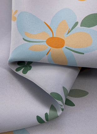 a close up of a flower print on a sheet