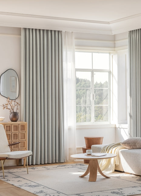 a living room filled with furniture and a large window