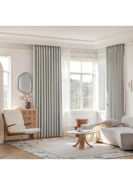 a living room filled with furniture and a large window