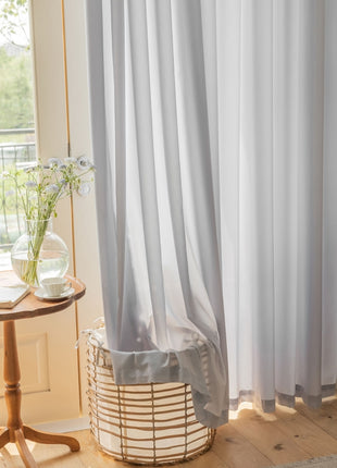 a table with a vase of flowers on top of it