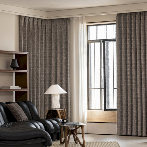 a living room filled with furniture and a large window