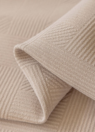 a close up view of a beige fabric