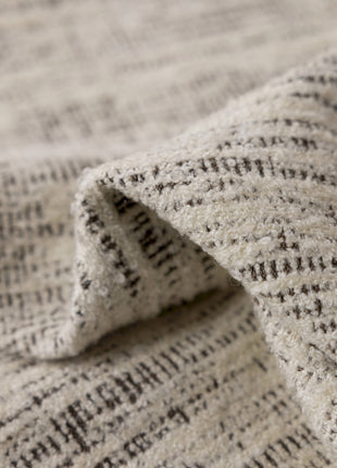 a close up of a white and black blanket