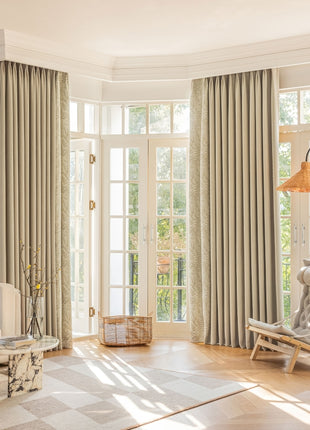 a living room filled with furniture and a large window